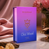 Soghaat Bujairami Chic Wood 100ml unisex eau de parfum in a vibrant purple and blue gradient box with gold logo.