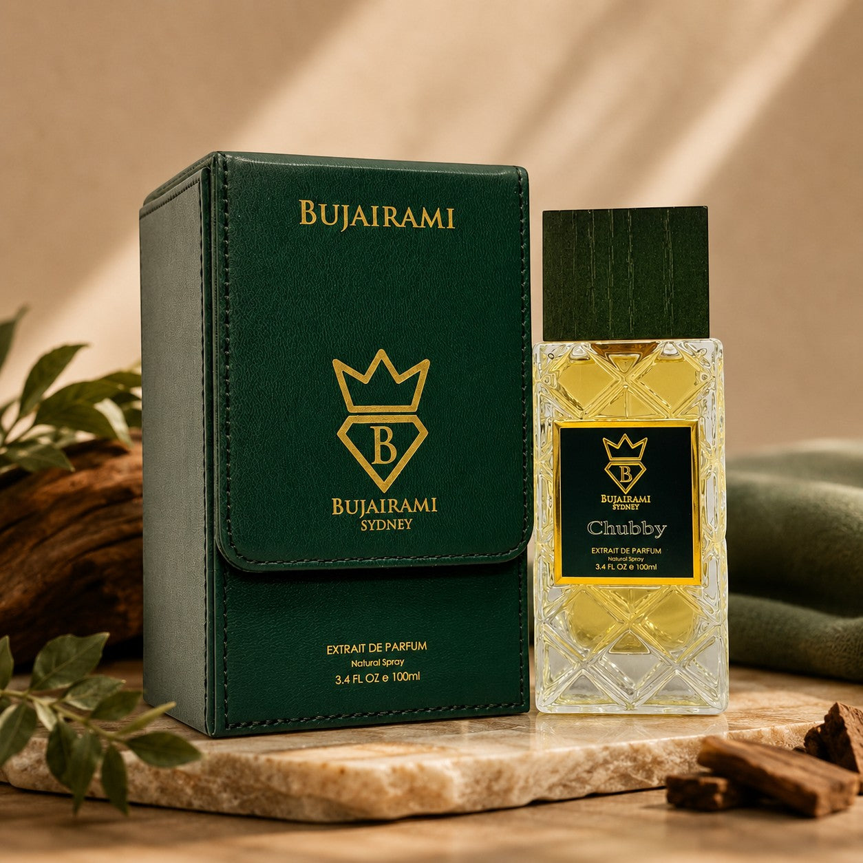 Bujairami Chubby 100ml Extrait de Parfum bottle and green case, featuring citrus, woody, and musky notes.