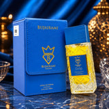Soghaat Bujairami Drip 100ml Extrait de Parfum in a blue leather case and textured glass bottle on a marble surface.