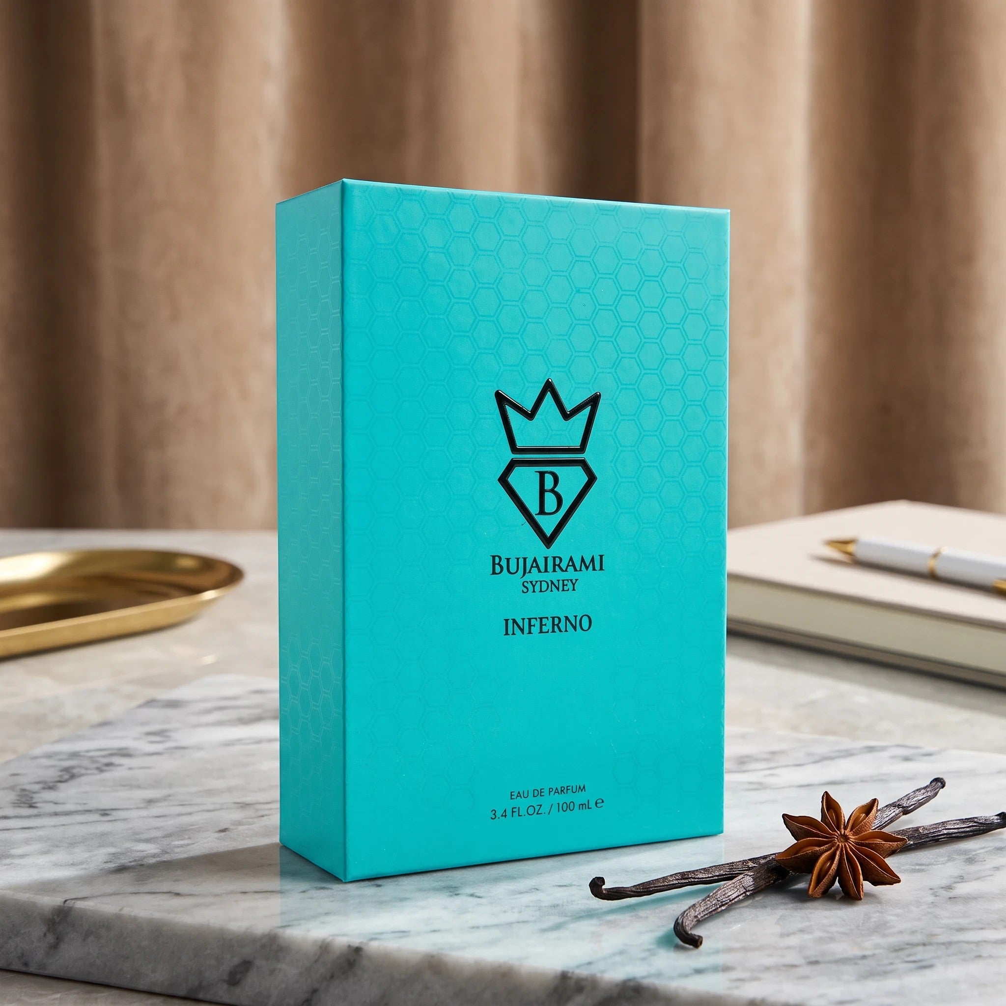 Soghaat Bujairami Inferno unisex Eau de Parfum in a vibrant turquoise box with a honeycomb pattern on marble surface.