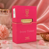 Soghaat Bujairami Ivory Tower 100ml Eau de Parfum in a vibrant pink box with gold branding on a marble surface.