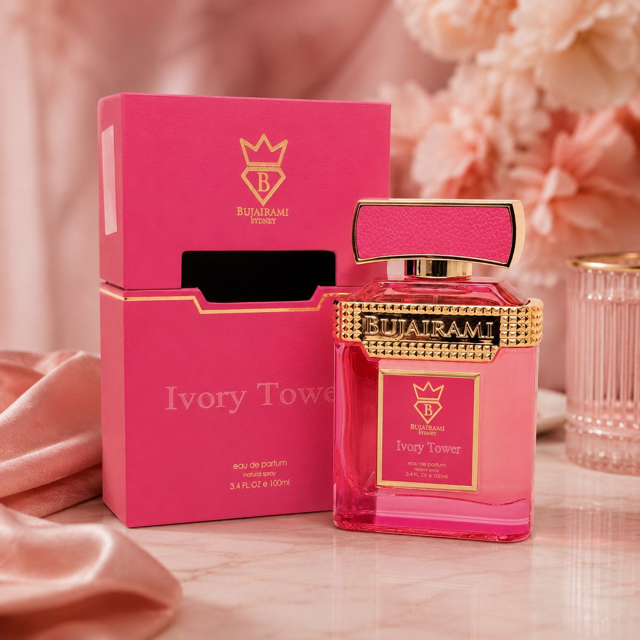 Soghaat Bujairami Ivory Tower 100ml Eau de Parfum in a vibrant pink bottle and matching box with gold accents.