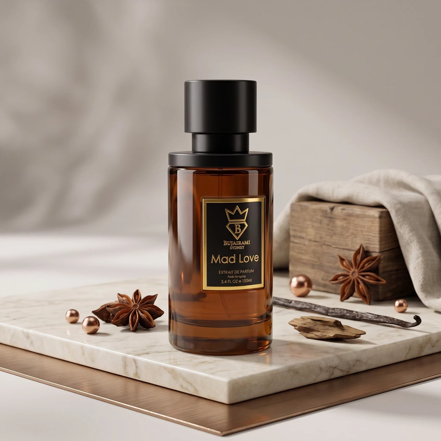 Soghaat Bujairami Mad Love 100ml Extrait de Parfum bottle on a marble surface with star anise and wood accents.