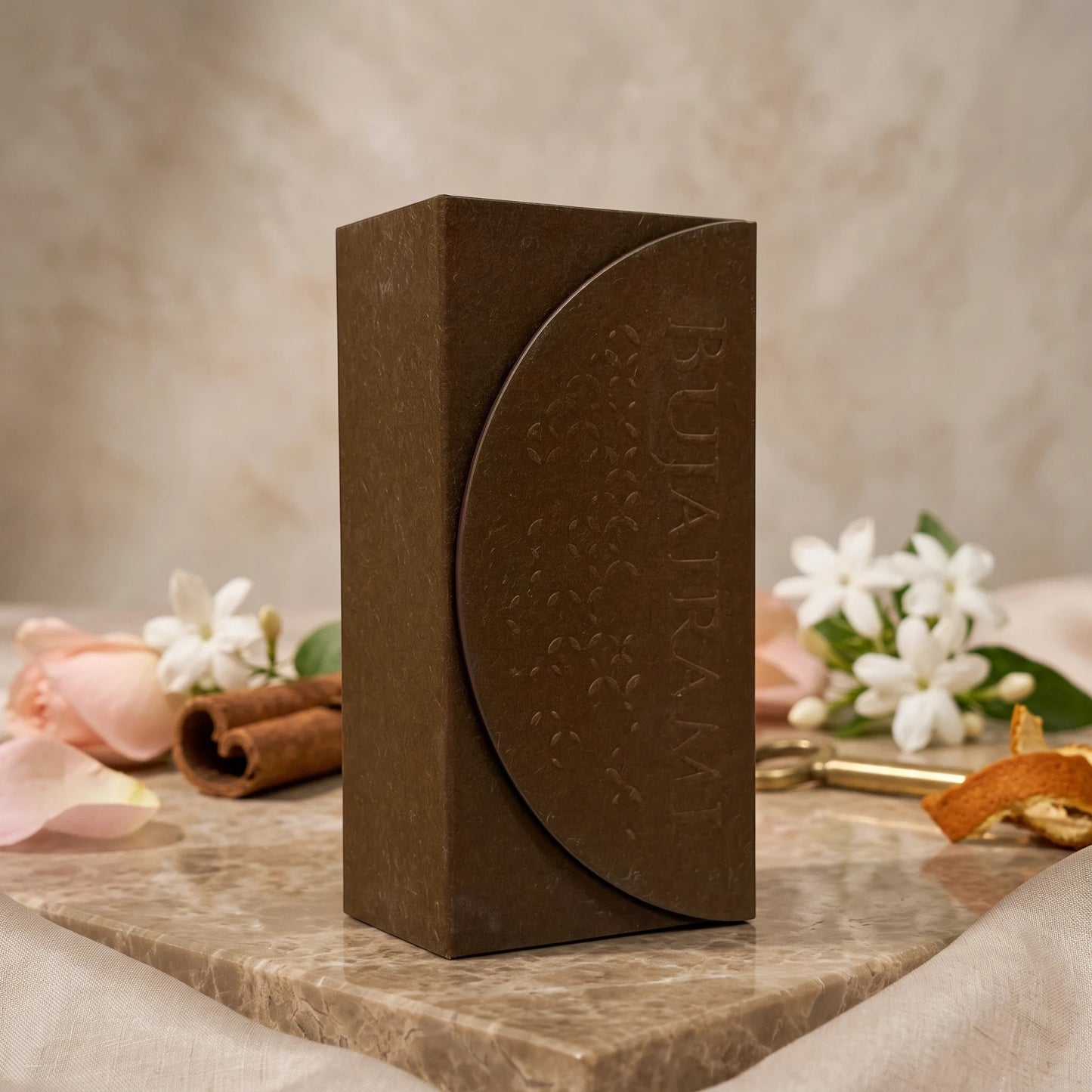 Soghaat Bujairami Mad Love Extrait de Parfum bottle in a dark brown textured box, styled with rose and cinnamon.