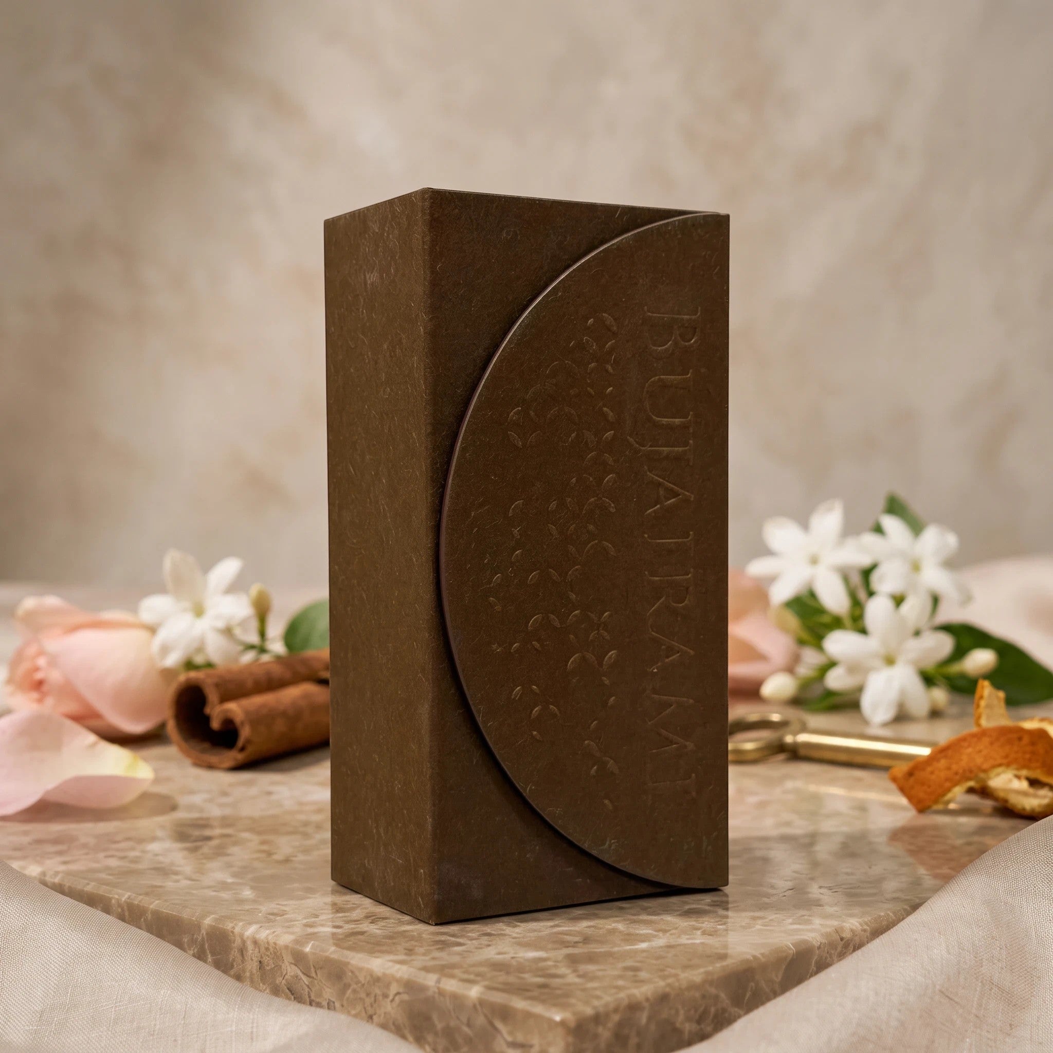 Soghaat Bujairami Mad Love Extrait de Parfum bottle in a dark brown textured box, styled with rose and cinnamon.