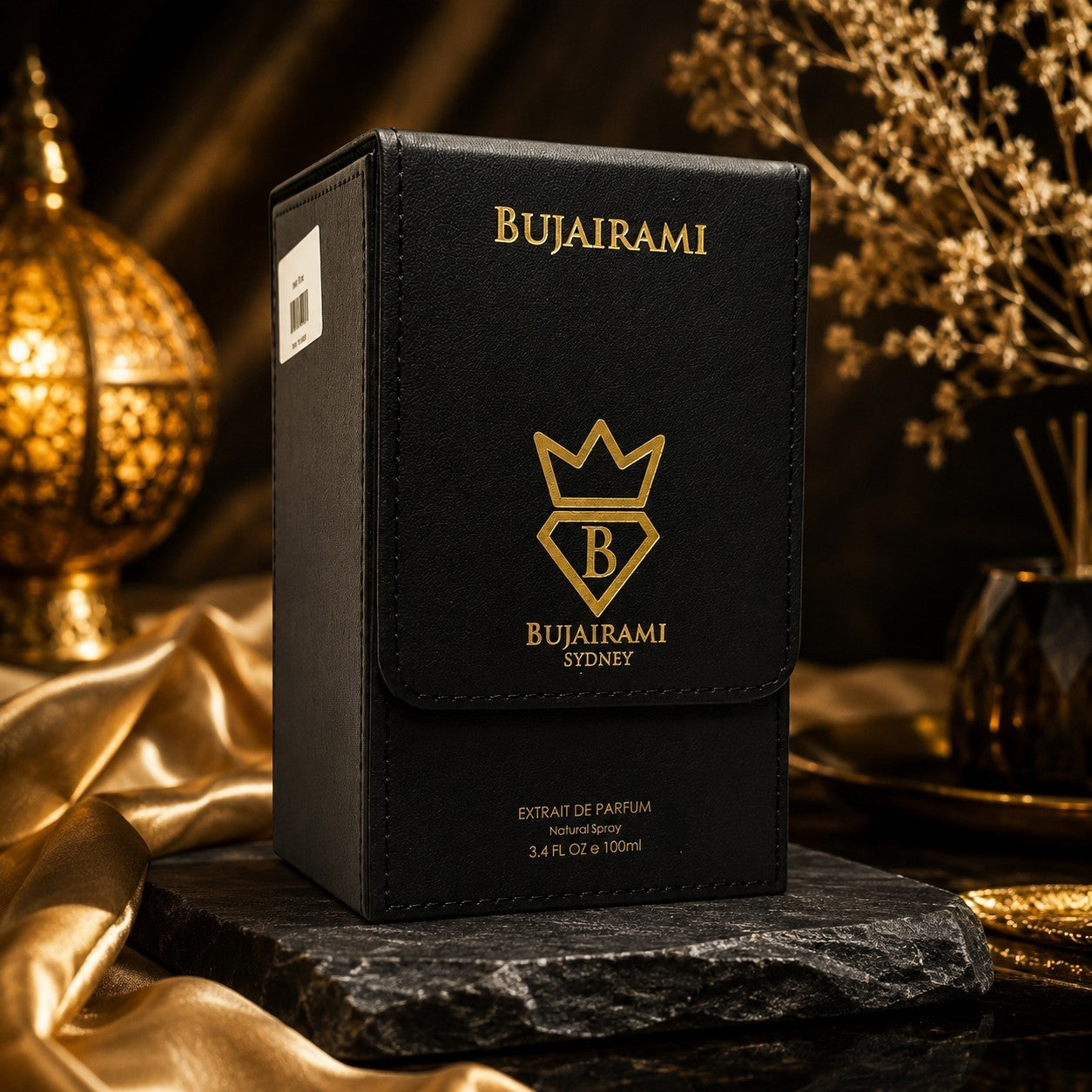 Soghaat Bujairami Mafia Boss Extrait de Parfum in a black leather-style box with gold logo on a stone display base.