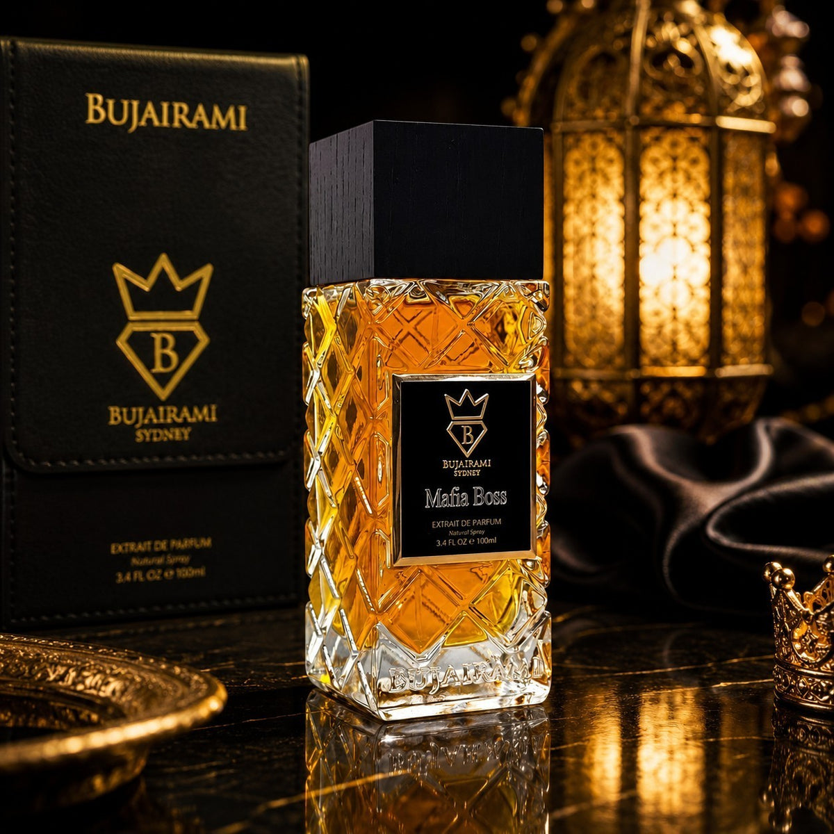 Soghaat Bujairami Mafia Boss Extrait de Parfum in a crystal glass bottle with a black cap on a dark reflective surface