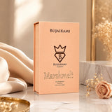 Soghaat Bujairami Marshmelt 100ml Eau de Parfum in a peach-coloured box with elegant branding on a marble surface.