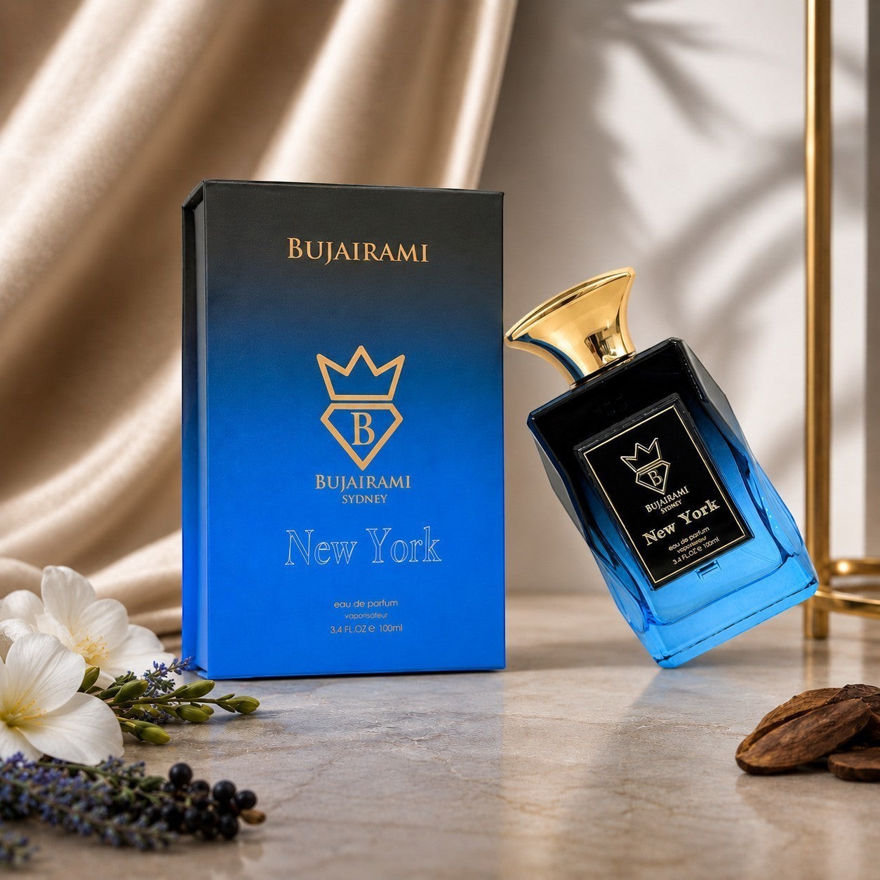Bujairami New York Eau de Parfum 100ml bottle and box, featuring blue gradient and gold accents. Unisex fragrance.