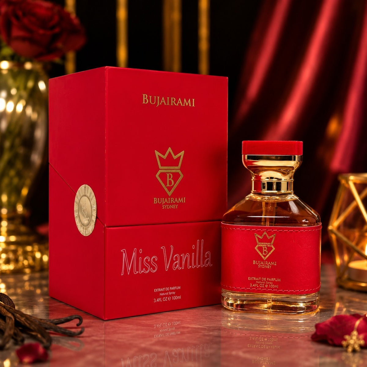 Soghaat BUJAIRAMI SYDNEY Miss Vanilla perfume bottle and red gift box with gold accents on a reflective surface.