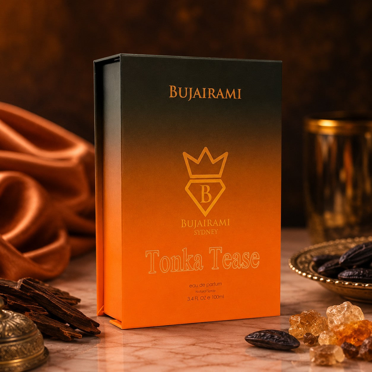Soghaat Bujairami Tonka Tease unisex Eau de Parfum in a gradient orange and black box with gold branding.