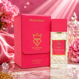 Soghaat Bujairami Too Damn Clean 100ml Extrait de Parfum bottle and pink leather case on a marble surface.