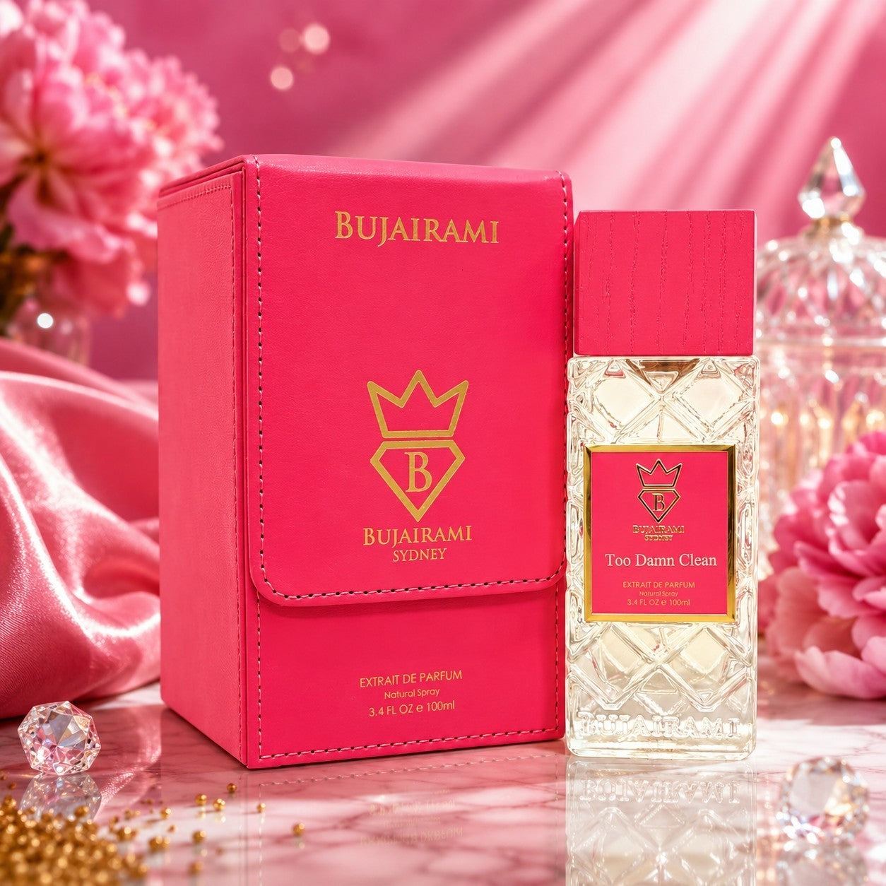 Soghaat Bujairami Too Damn Clean 100ml Extrait de Parfum bottle and pink leather case on a marble surface.