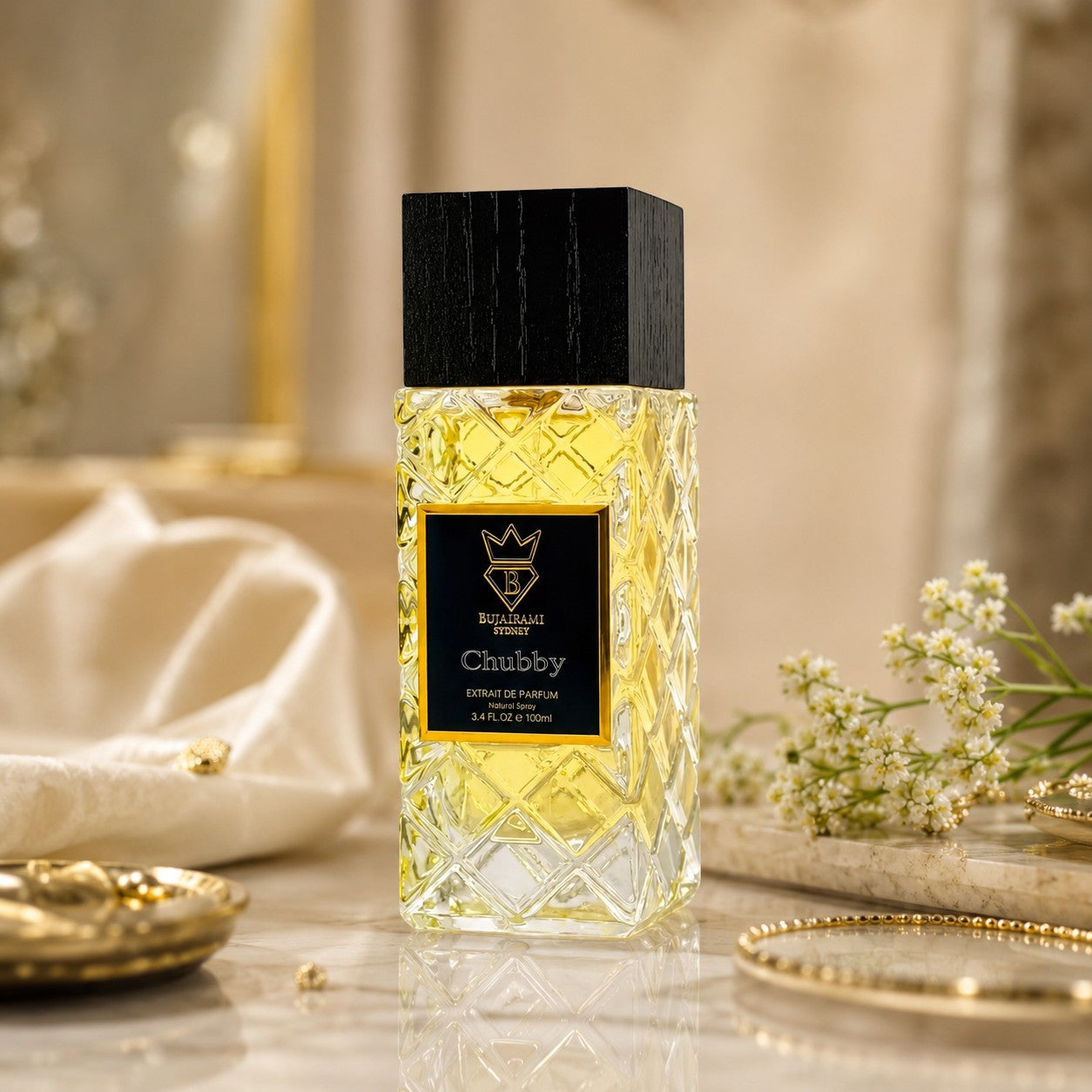 Soghaat Chubby 100ml Extrait de Parfum, a unisex fragrance with citrus, aquatic, and woody notes in a clear glass bottle with a black cap.