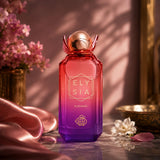 Soghaat Elysia Elegance 100ml Eau de Parfum in a gradient red and purple glass bottle with a metallic rose gold cap.