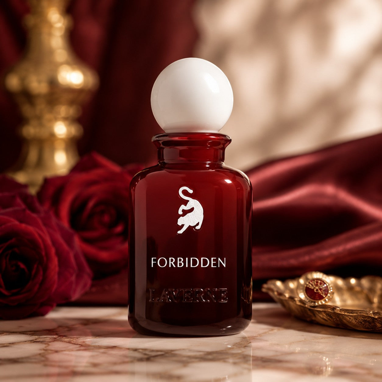 Soghaat Forbidden Eau de Parfum for women in a deep red glass bottle with a white spherical cap. Notes of marshmallow, cherry, rose, amber, and musk.