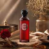 Soghaat Fouco by Anfar 100ml Extrait de Parfum in a deep red bottle with a decorative black cap on a stone surface.