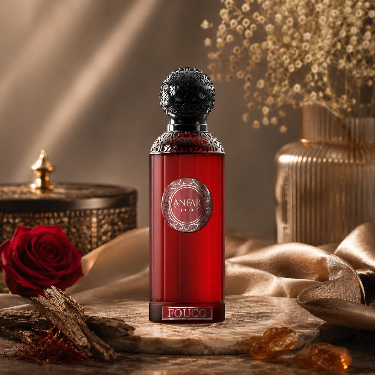 Soghaat Fouco by Anfar 100ml Extrait de Parfum in a deep red bottle with a decorative black cap on a stone surface.