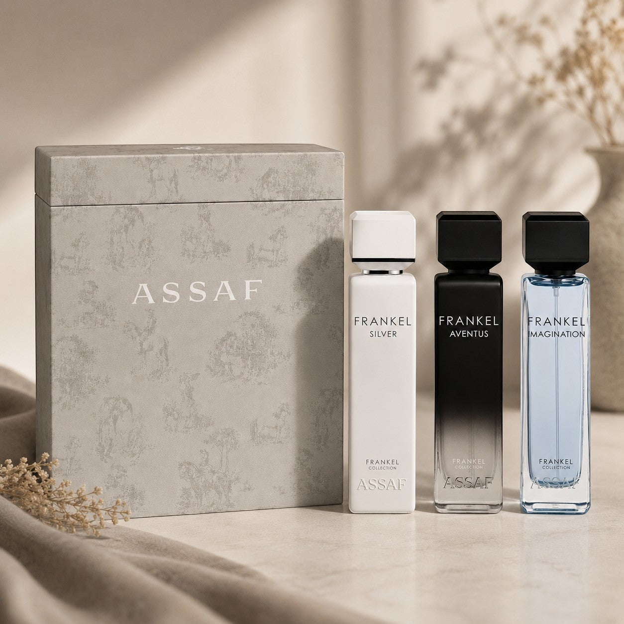 Frankel Collection Gift Set by Assaf, featuring three 100ml Eau de Parfum bottles: Silver, Aventus, and Imagination, with a decorative grey gift box.