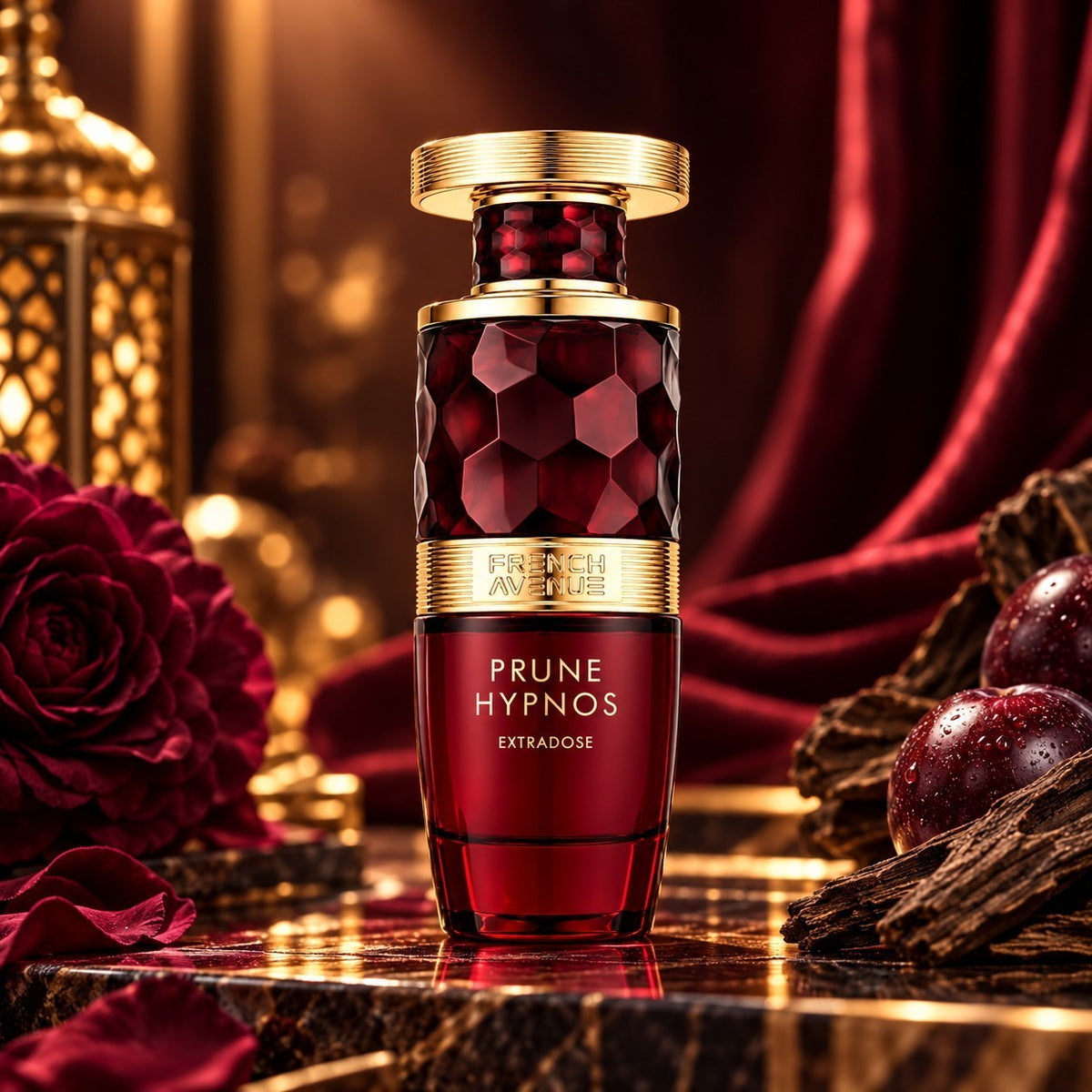Soghaat French Avenue Prune Hypnos Extradose perfume bottle with a deep red glass design and gold cap on a dark table.