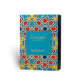 Soghaat Granada Eau de Parfum 100ml box with a geometric pattern in blue, yellow, red, and white. Features a central teal panel.