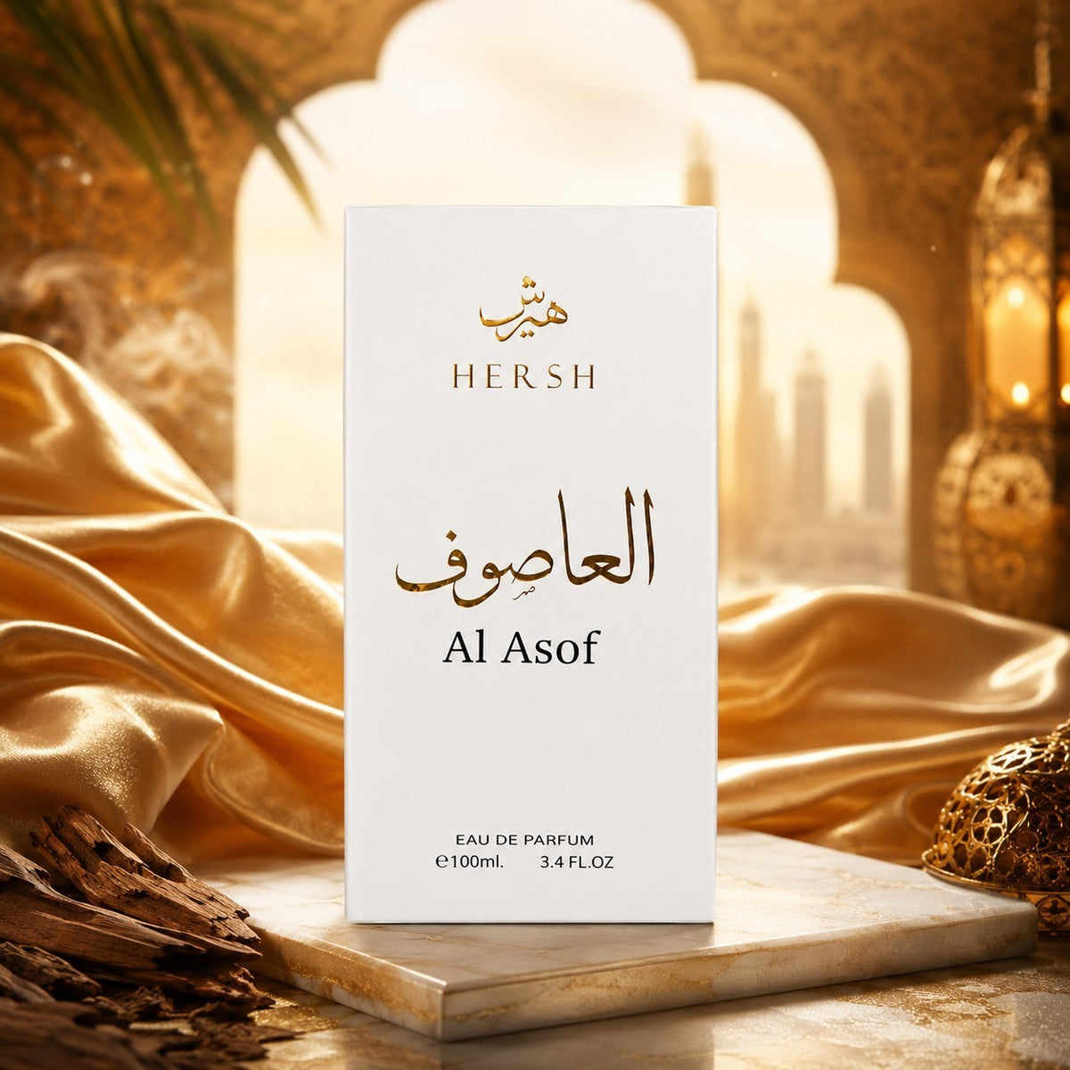 Soghaat Hersh Al Asof 100ml Eau de Parfum white box with gold Arabic calligraphy on a marble surface with silk fabric.