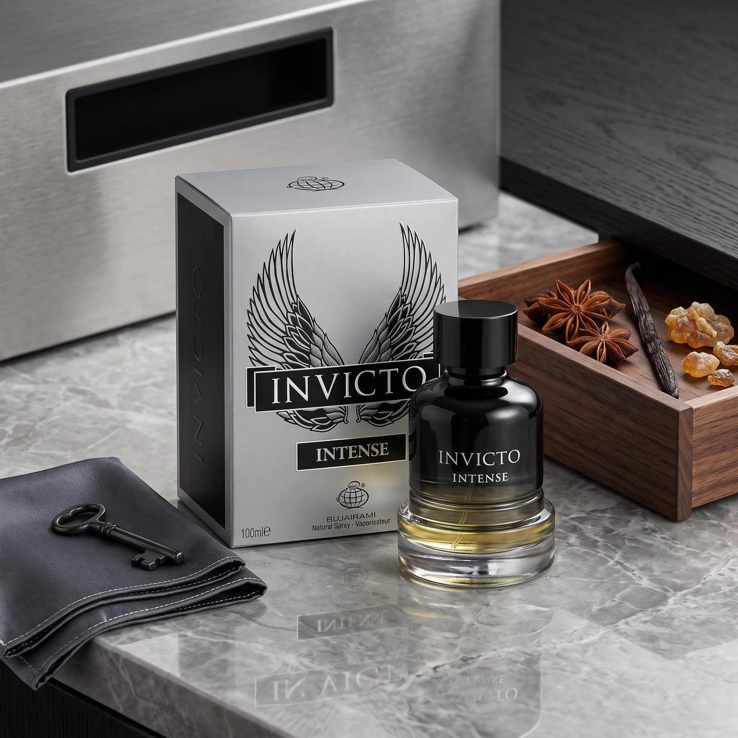 Soghaat Invicto Intense 100ml Eau de Parfum bottle and box with spices and a key on a marble surface.