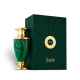 Soghaat Jade Extrait de Parfum bottle with malachite green and gold accents, next to its dark green box.