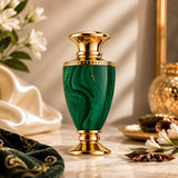 Soghaat Jade Extrait de Parfum, a green malachite bottle with gold accents, featuring woody, jasmine, and amber notes.