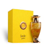 Soghaat Jade Giallo Extrait de Parfum bottle with marbled yellow and orange glass and gold accents, next to a bright yellow box.
