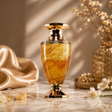 Soghaat Jade Giallo Extrait de Parfum bottle with marbled yellow and brown glass and gold accents.