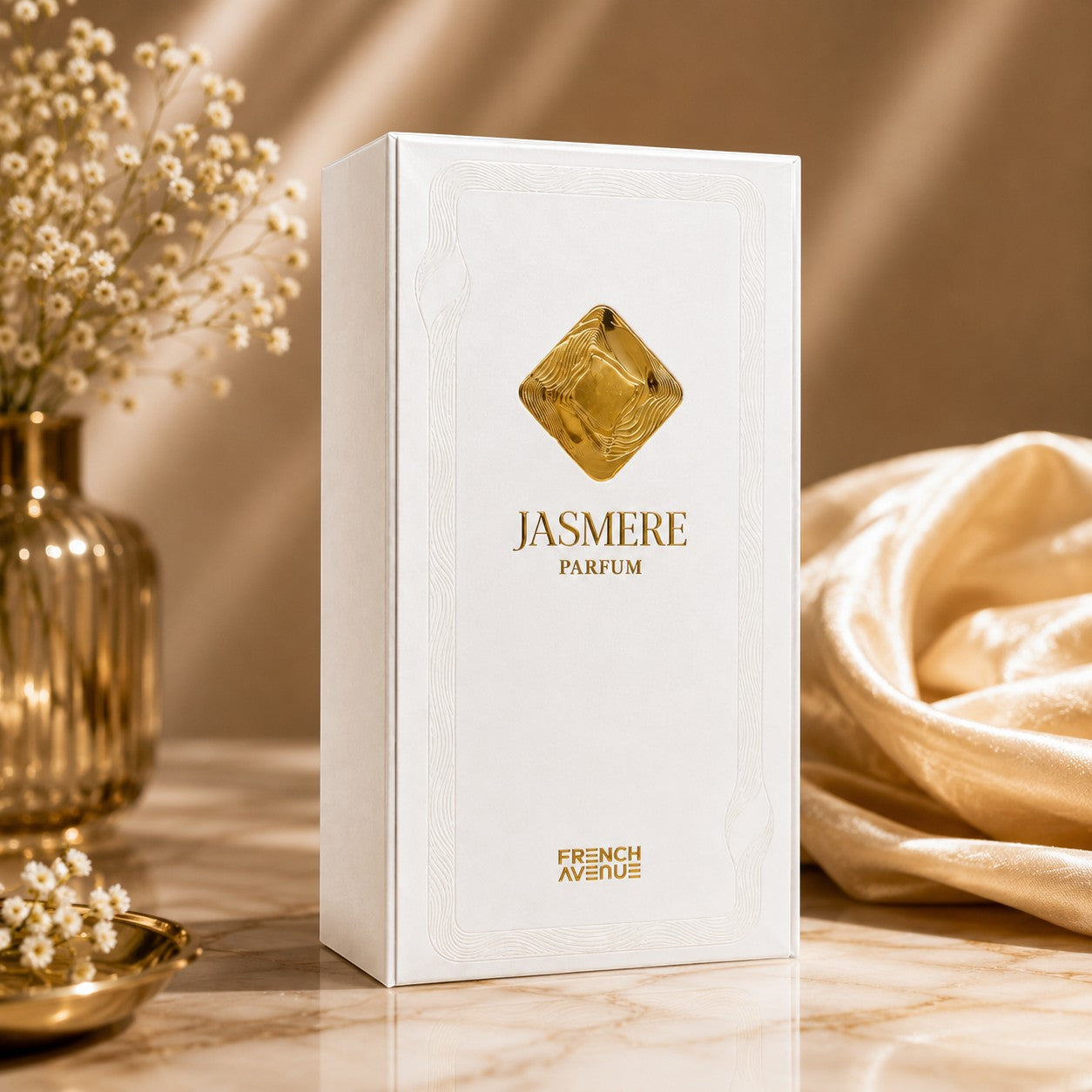 Soghaat Jasmere Extrait de Parfum by French Avenue in a white box with gold emblem on a marble surface with flowers.
