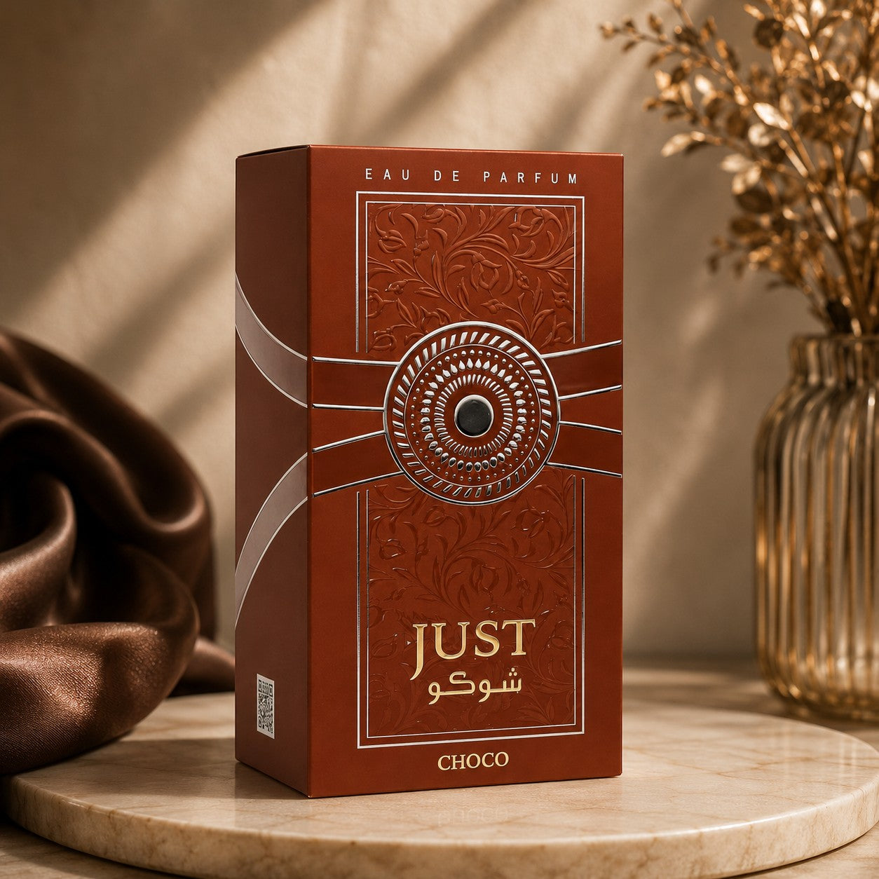 Soghaat Just Choco Eau de Parfum 100ml bottle with embossed floral patterns and silver accents. Sweet gourmand fragrance.