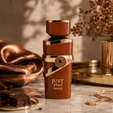 Soghaat Just Choco Eau de Parfum, a rich brown bottle with gold accents, featuring chocolate and vanilla notes.
