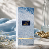 Soghaat Kaaf by Ahmed Al Maghribi 100ml Extrait de Parfum in a blue textured box on a marble surface with silk.