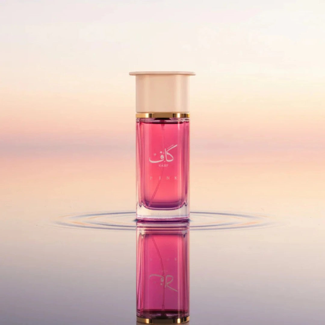 Soghaat Kaaf Pink Extrait de Parfum for men, a woody, fresh citrus, and floral fragrance in a pink glass bottle.
