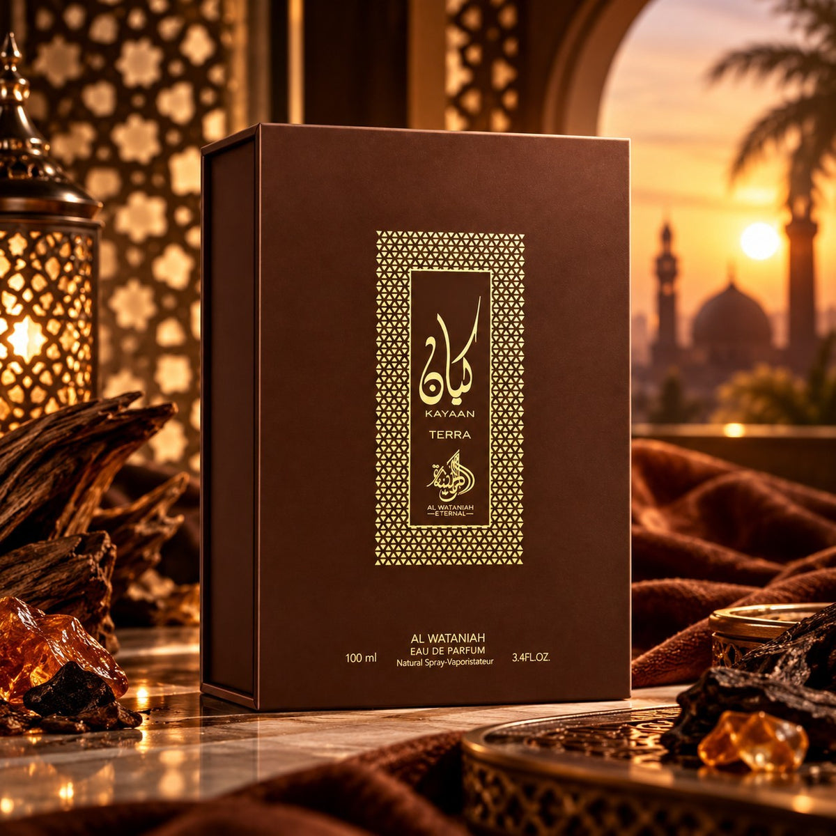 Soghaat Kayaan Terra Eau de Parfum by Al Wataniah in a brown box with gold accents, set against a sunset backdrop.