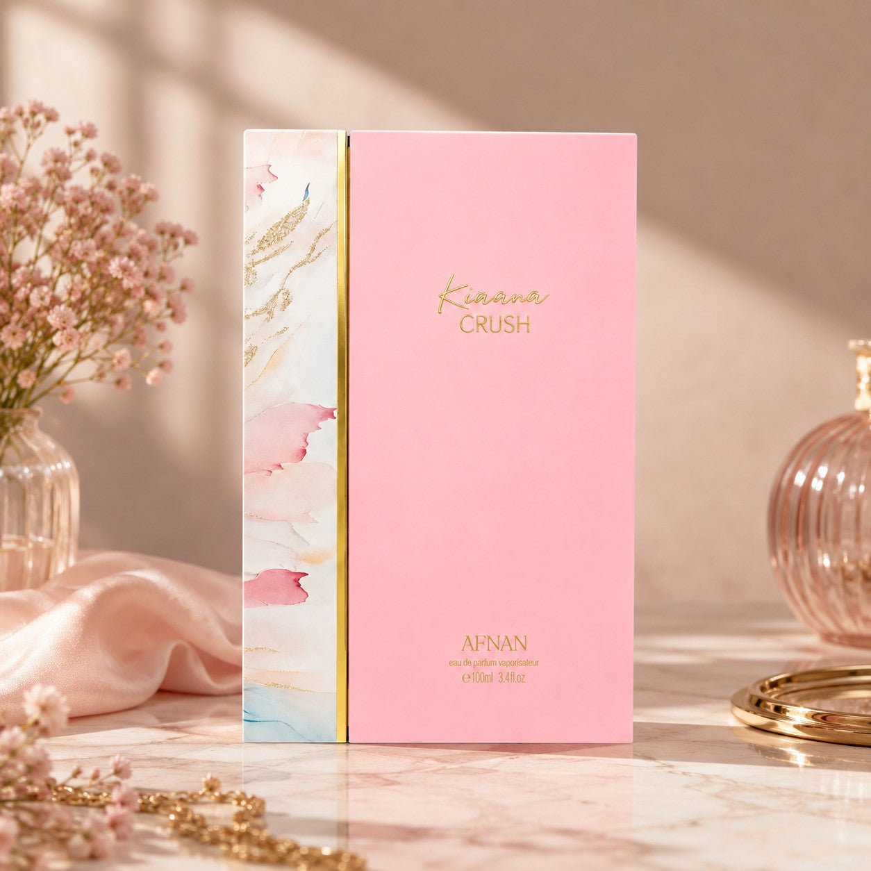 Soghaat Kiaana Crush Eau de Parfum by Afnan in a pink box with marble-style side panel, displayed on a marble table.