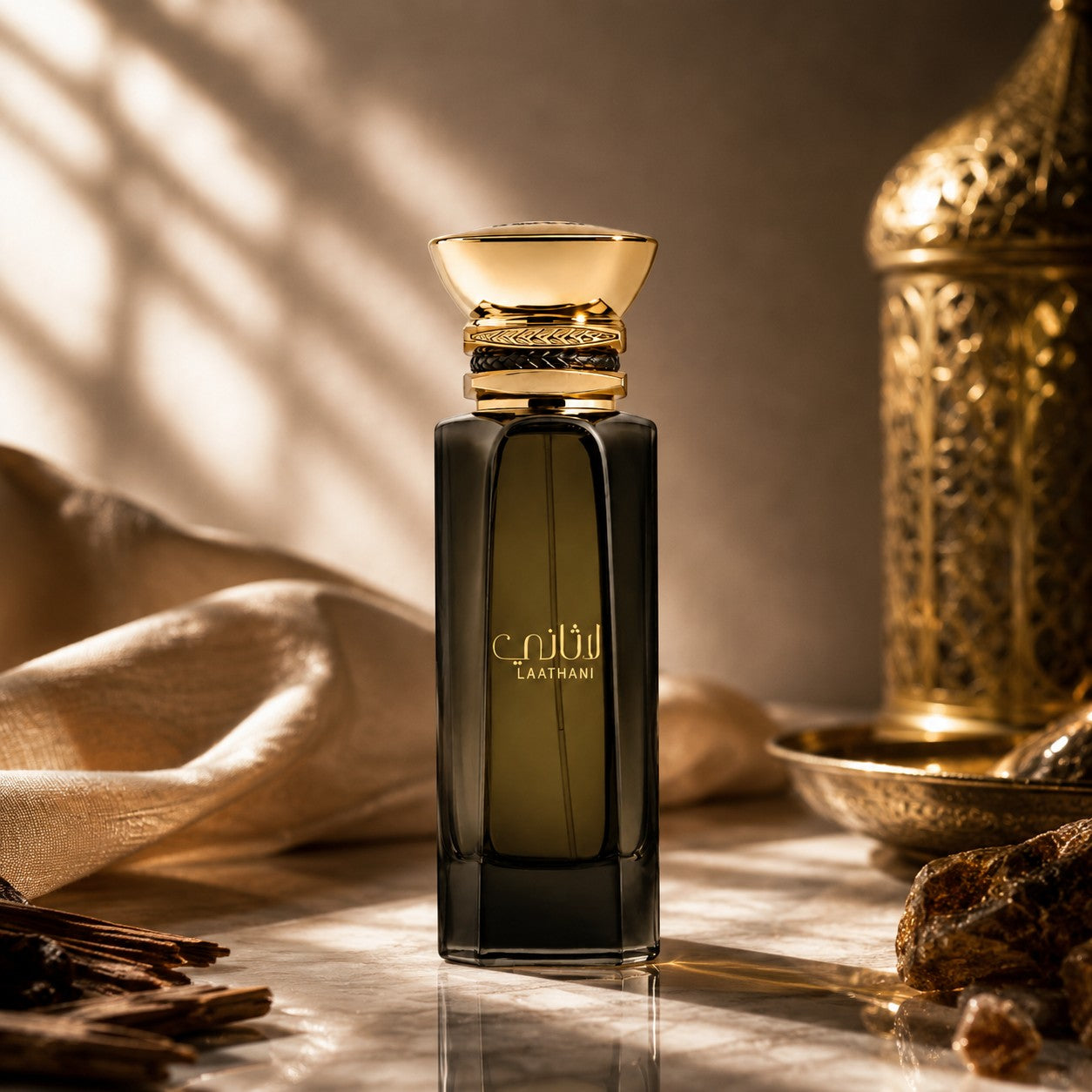 Soghaat Laathani Eau de Parfum by Ahmed Al Maghribi in a dark glass bottle with a gold cap, set on a marble surface.