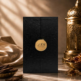 Soghaat Ahmed Al Maghribi Laathani Eau de Parfum in a black textured box with a gold circular logo on a marble surface.