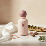 Soghaat Lady Rose Eau de Parfum by Laverne, a pale pink bottle with a mauve cap, featuring embossed text and a stylized animal logo.