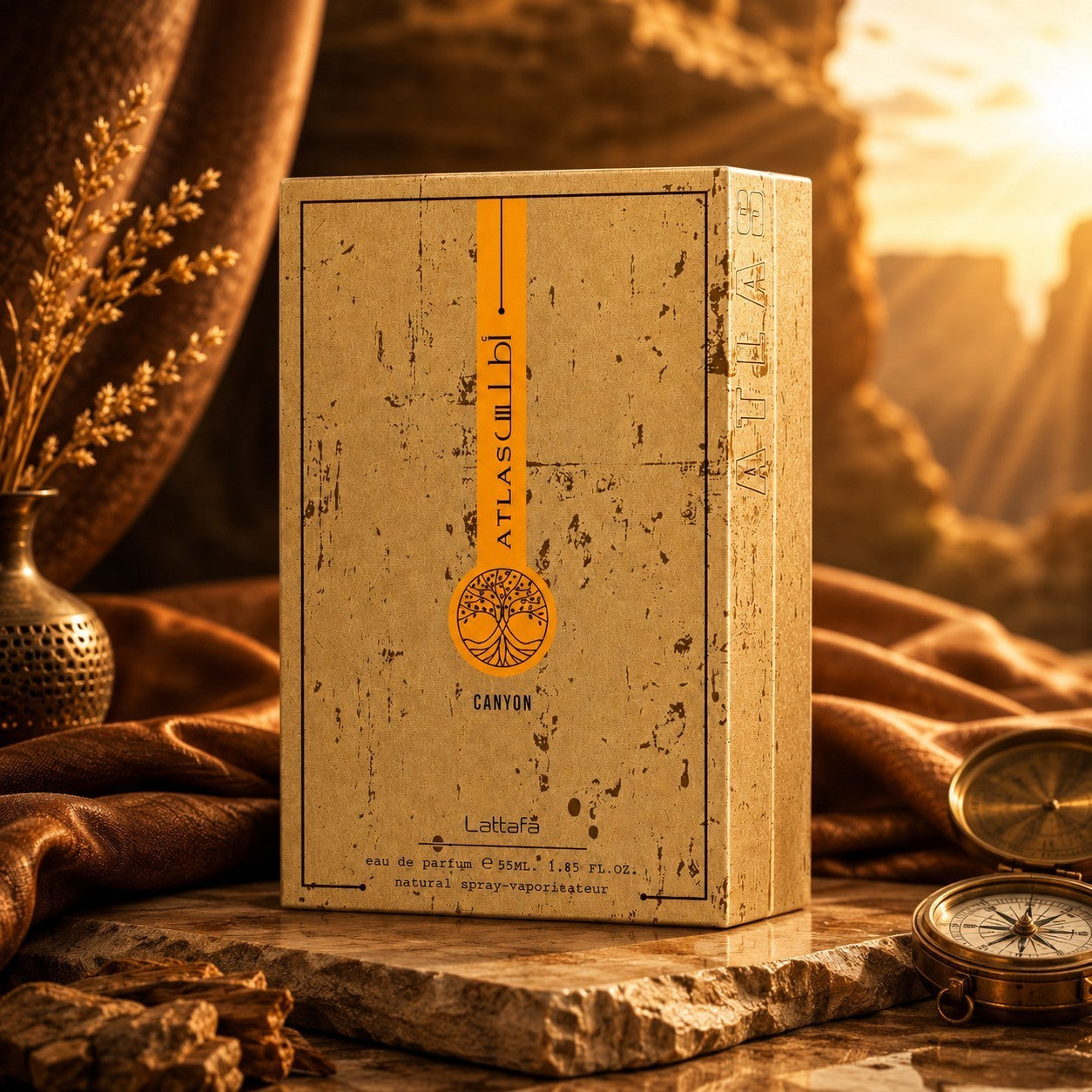 Soghaat Lattafa Atlas Canyon 55ml Eau de Parfum bottle in a rustic, desert-inspired setting with a vintage compass.