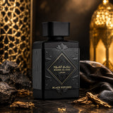 Soghaat Badee Al Oud Black Exposed by Lattafa perfume bottle with ornate black matte finish and gold lettering.