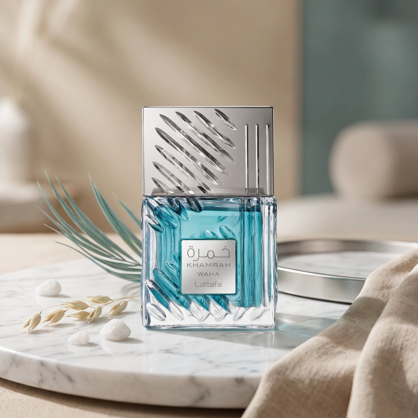 Soghaat Lattafa Khamrah Waha unisex Eau de Parfum in a textured blue glass bottle with a silver cap on marble.