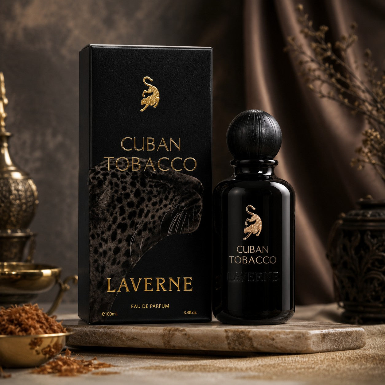 Soghaat Laverne Cuban Tobacco 100ml Eau de Parfum bottle and black box with gold leopard logo on a marble stand.