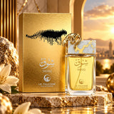 Soghaat Le Falcone Shouq Eau de Parfum bottle and gold box on a marble pedestal with a sunset background.