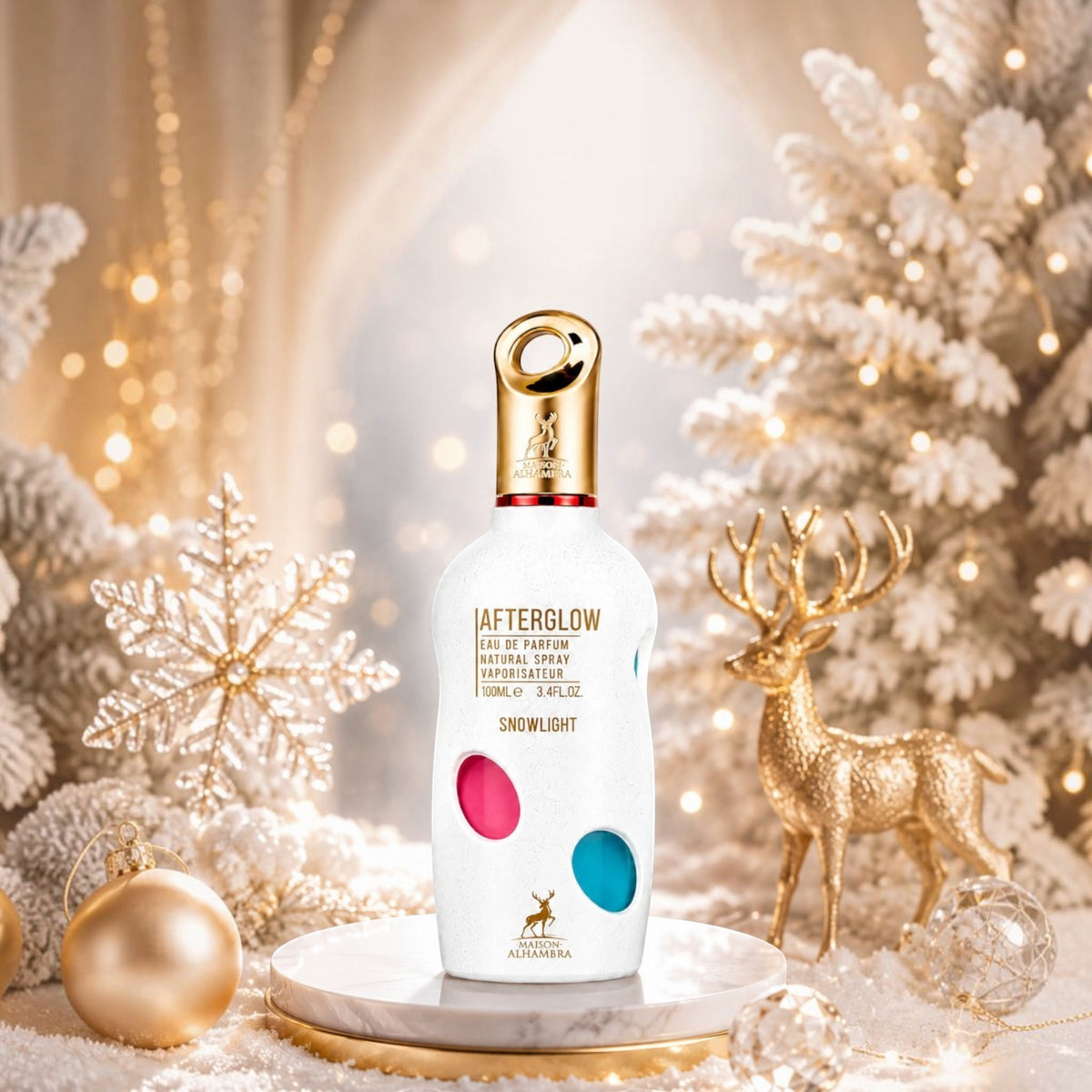 Soghaat Maison Alhambra Afterglow Snowlight 100ml perfume bottle in a festive winter setting with gold reindeer.