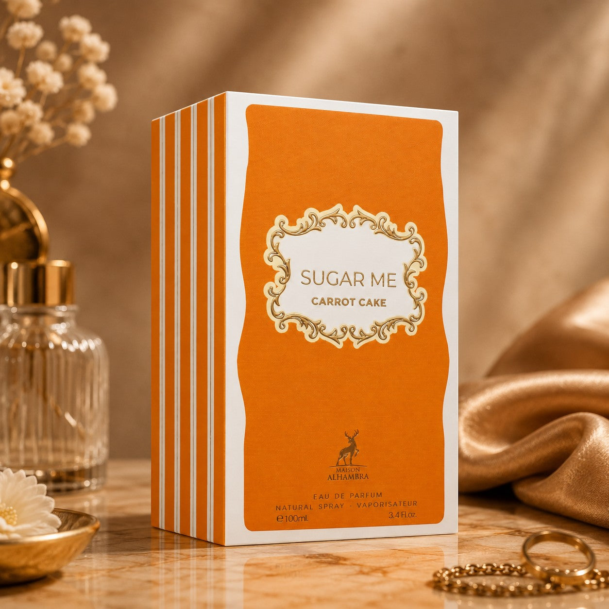 Soghaat Maison Alhambra Sugar Me Carrot Cake Eau de Parfum box in orange and white on a marble surface.