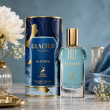 Soghaat Maison Alhambra Glacier Flora 100ml unisex Eau de Parfum bottle and blue floral patterned box on marble surface.