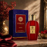 Soghaat Maison Alhambra Philos Shine 100ml Eau de Parfum bottle in red with gold cap next to its blue and red box.